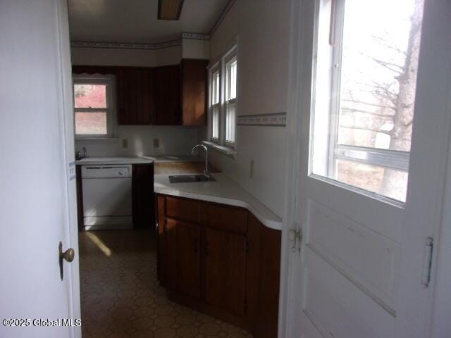 kitchen with sink and white dishwasher