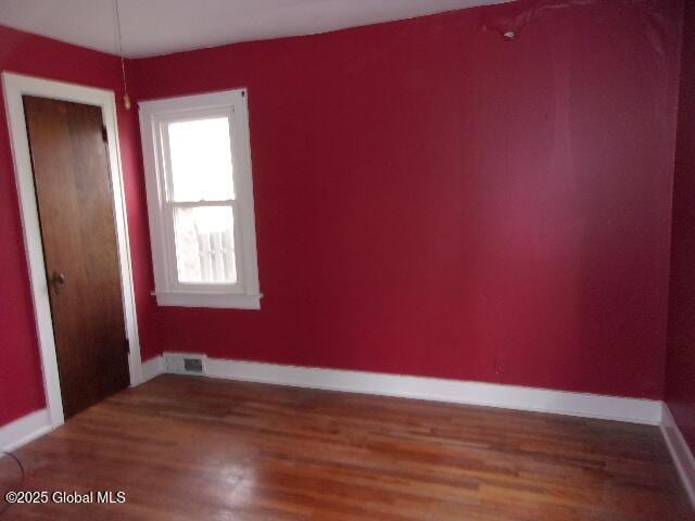 empty room featuring hardwood / wood-style floors