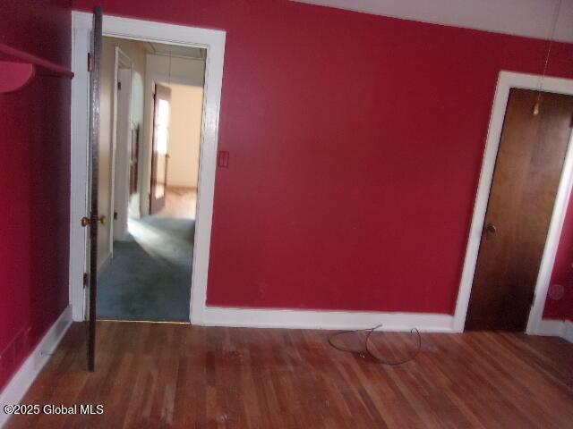 unfurnished bedroom featuring hardwood / wood-style floors