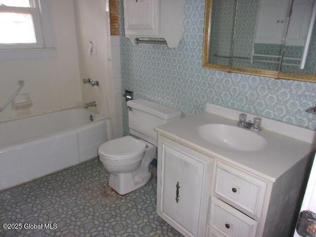 full bathroom with toilet, bathing tub / shower combination, and vanity