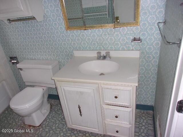 bathroom with vanity and toilet