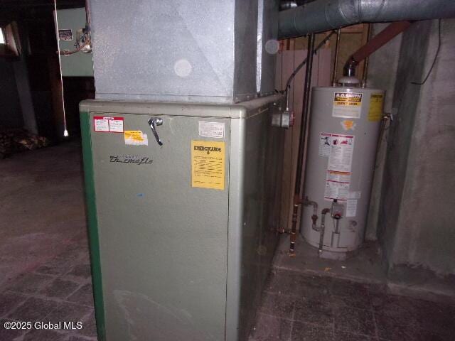 utility room featuring gas water heater and heating unit