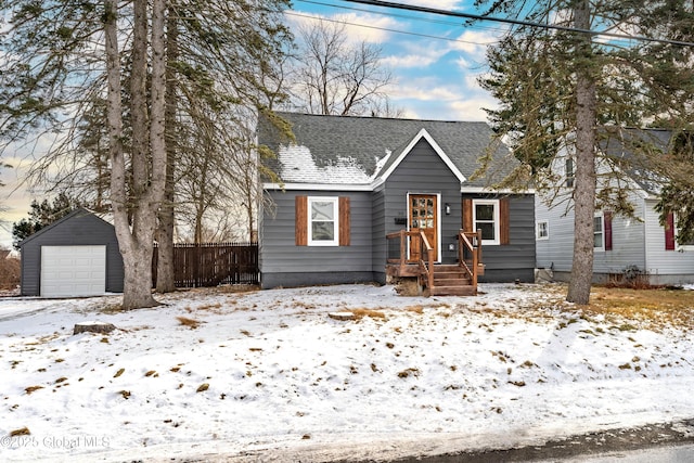 bungalow with an outbuilding and a garage