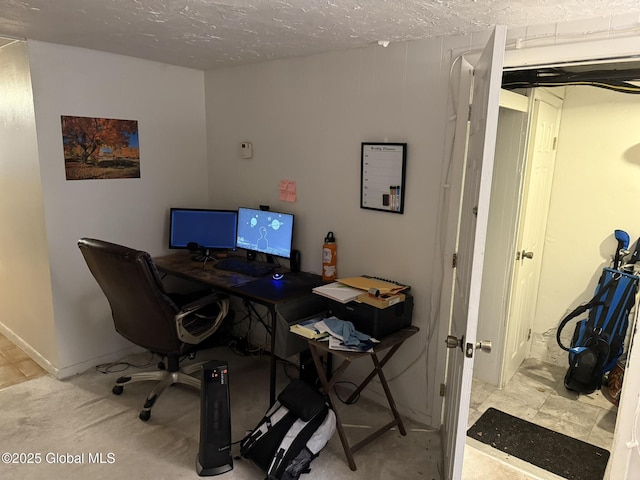 home office featuring a textured ceiling