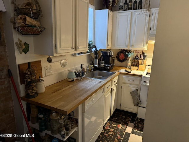 kitchen featuring white cabinetry, sink, white appliances, and wood counters