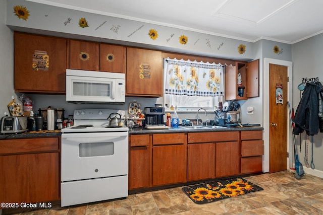 kitchen featuring sink, white appliances, and crown molding