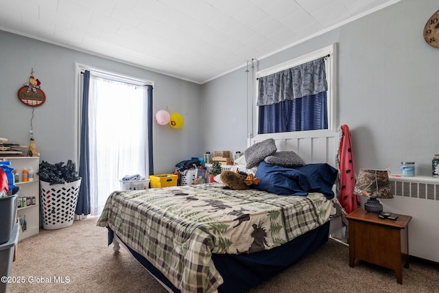 carpeted bedroom with radiator heating unit and ornamental molding