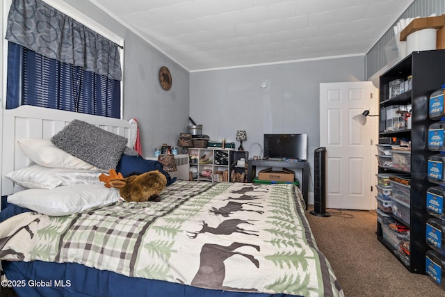 bedroom featuring crown molding and carpet flooring