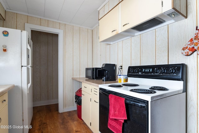 kitchen with dark wood-type flooring, white fridge, wooden walls, electric stove, and ornamental molding