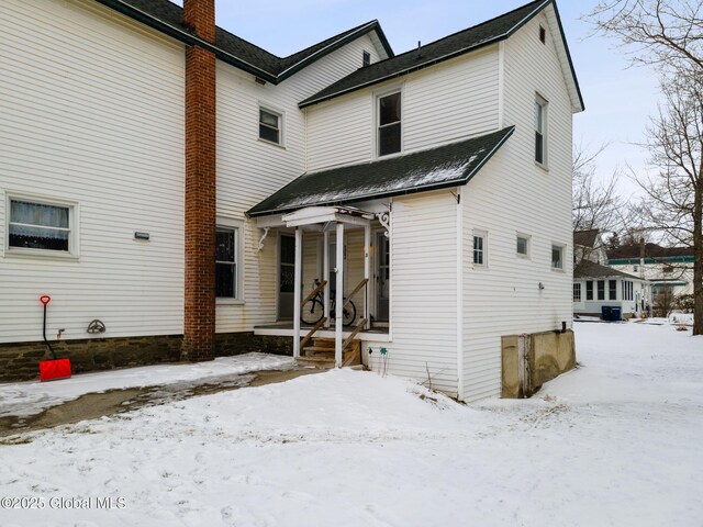 view of snow covered property