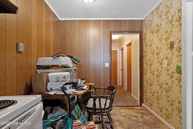 misc room with ornamental molding and wooden walls