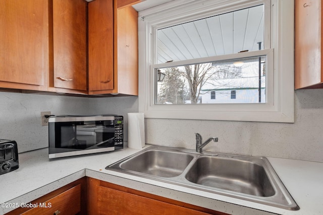 kitchen featuring sink and backsplash