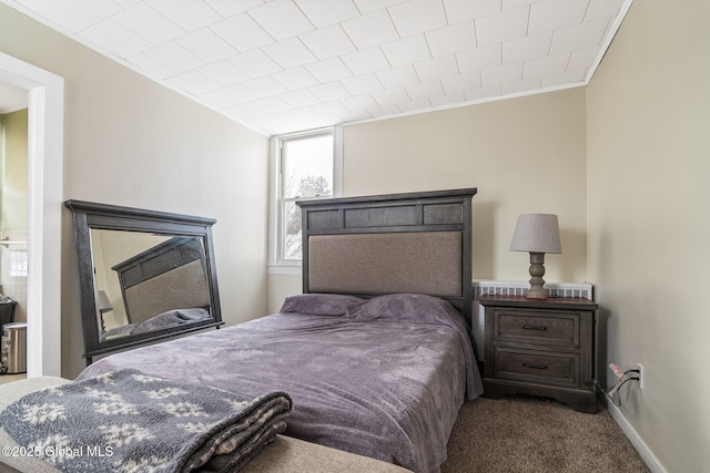 carpeted bedroom featuring ornamental molding