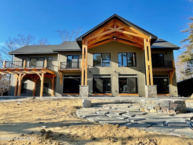 view of front of property with a balcony