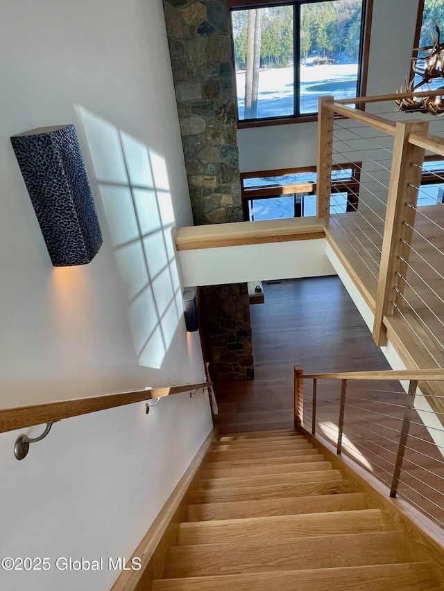 stairway featuring wood finished floors