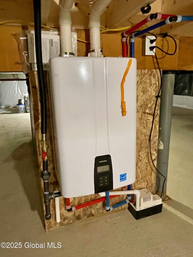 utility room featuring tankless water heater