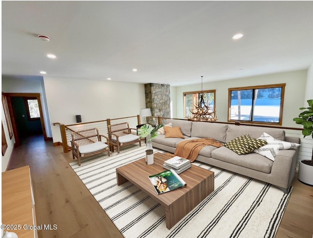 living area with light wood-style floors and recessed lighting