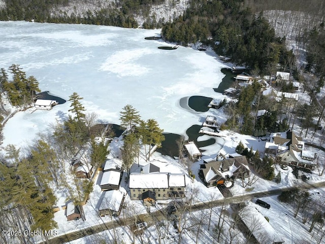 snowy aerial view featuring a residential view