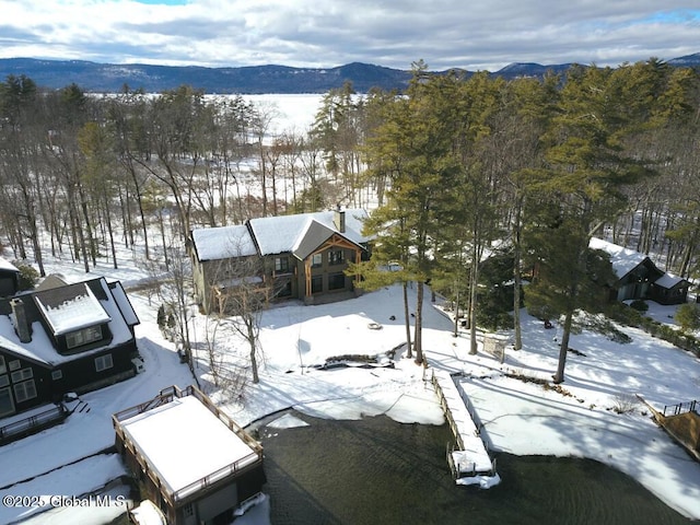 snowy aerial view featuring a mountain view