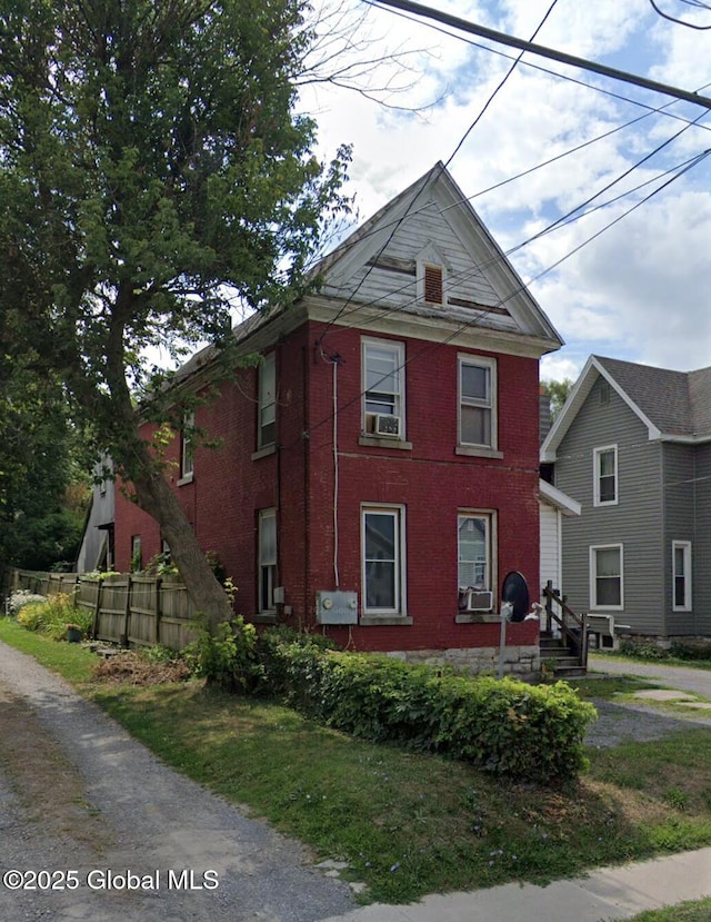 view of side of property with cooling unit