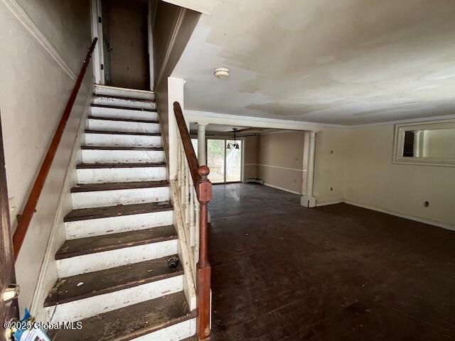 stairs featuring concrete floors