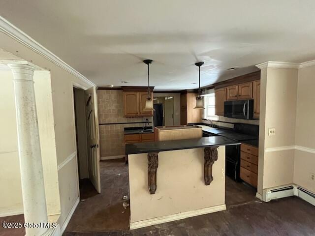 kitchen with a center island, sink, hanging light fixtures, ornamental molding, and a breakfast bar area