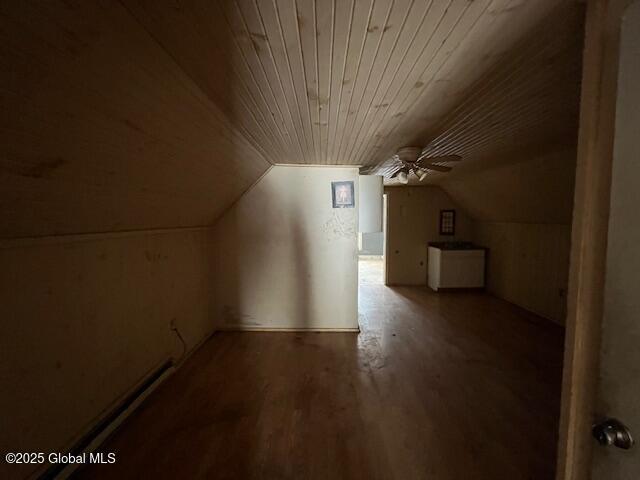 additional living space with ceiling fan, hardwood / wood-style floors, lofted ceiling, and wood ceiling