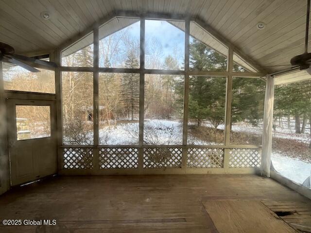 unfurnished sunroom with lofted ceiling