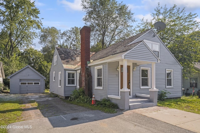 bungalow with an outbuilding and a garage