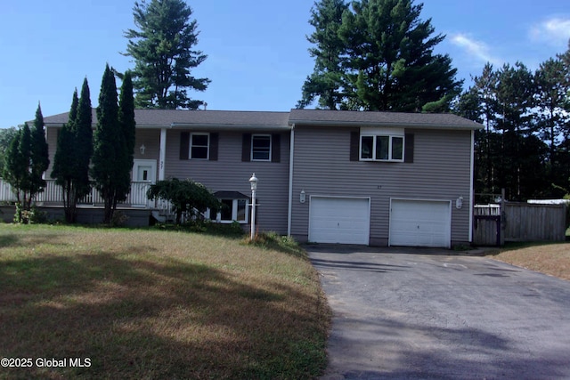 view of front of home with a garage and a front yard