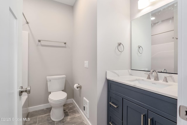 bathroom featuring toilet and vanity