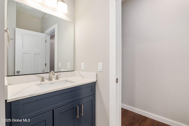 bathroom with wood-type flooring and vanity