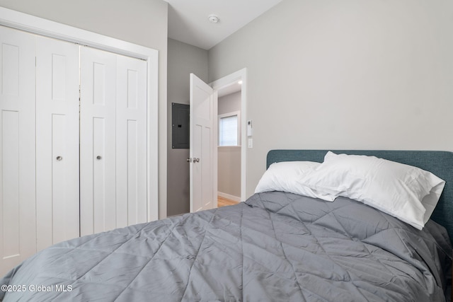 bedroom featuring a closet and electric panel