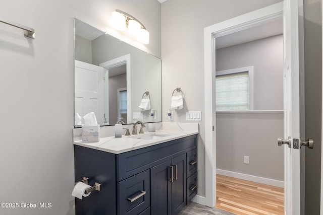 bathroom with vanity and hardwood / wood-style flooring