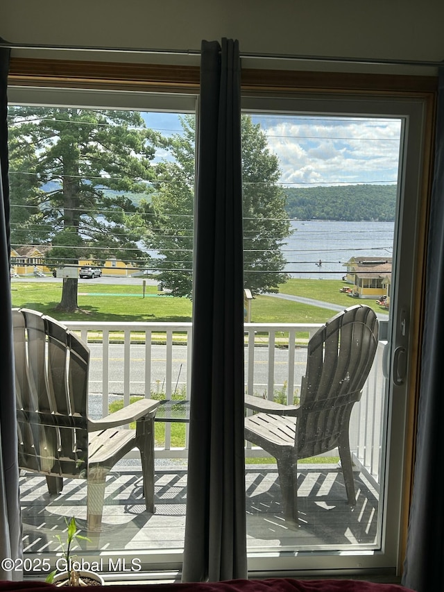 entryway with a water view and a wealth of natural light