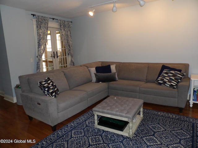 living room with hardwood / wood-style floors, rail lighting, and french doors