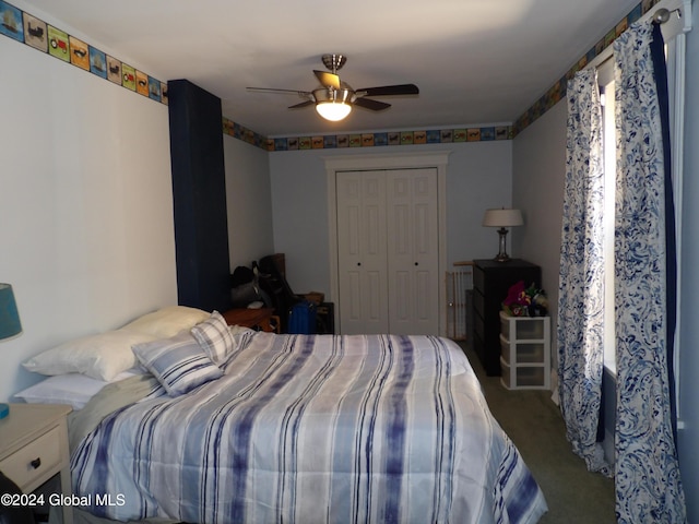 carpeted bedroom featuring ceiling fan and a closet