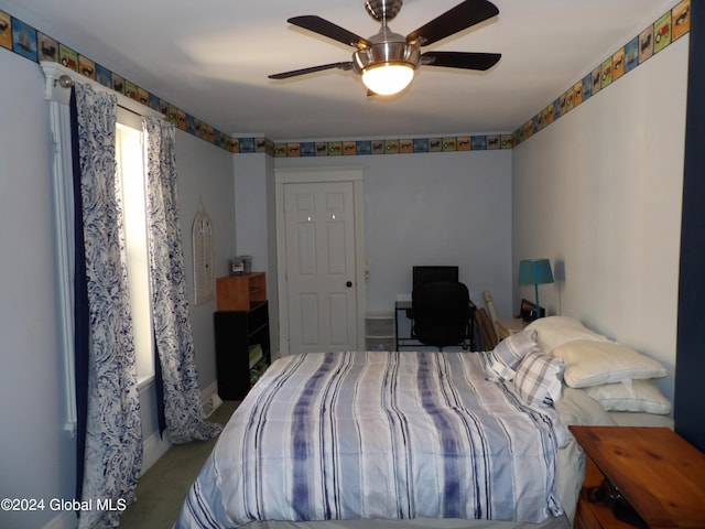 carpeted bedroom with ceiling fan