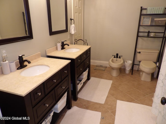 bathroom with a bidet, toilet, tile patterned flooring, and vanity