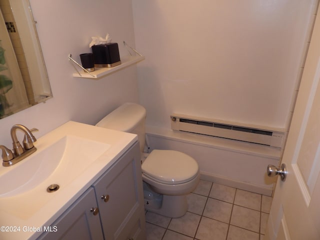 bathroom with toilet, vanity, tile patterned flooring, and a baseboard radiator