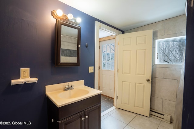 bathroom with vanity, tile patterned flooring, and a baseboard radiator