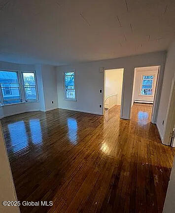 interior space with wood-type flooring and a wealth of natural light