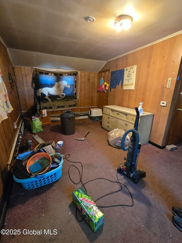 playroom featuring lofted ceiling and wooden walls