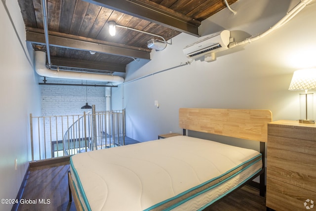 bedroom featuring hardwood / wood-style floors, a wall mounted AC, beam ceiling, and wood ceiling