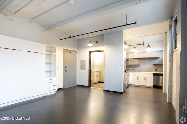 garage featuring sink and electric panel