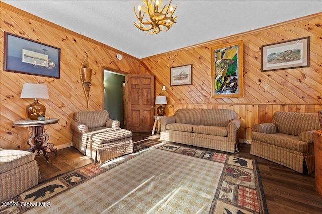 living room featuring a chandelier and dark hardwood / wood-style flooring