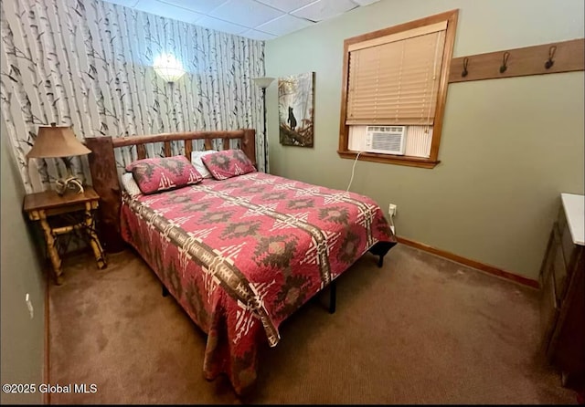 carpeted bedroom featuring cooling unit and a drop ceiling