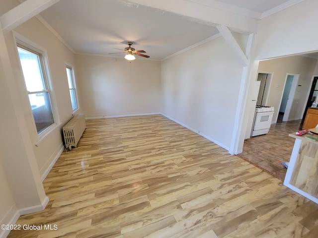 unfurnished room featuring ornamental molding, radiator, and light hardwood / wood-style floors