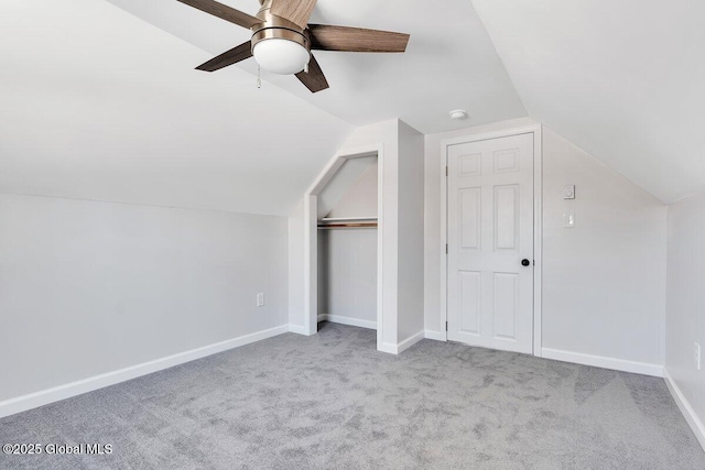 additional living space with lofted ceiling, light colored carpet, and ceiling fan