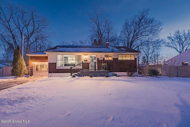 view of snow covered house